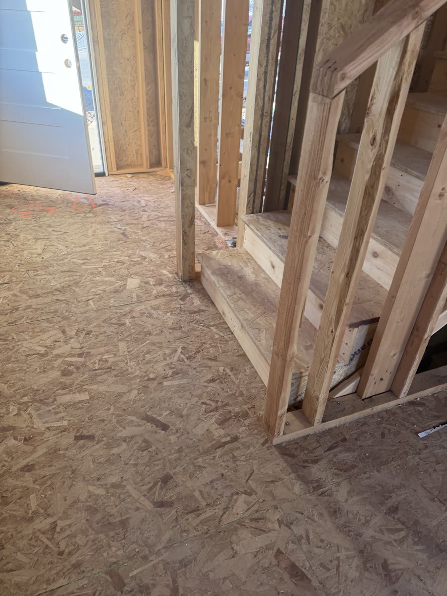 Wall framing and stair stringer detail on a residential build