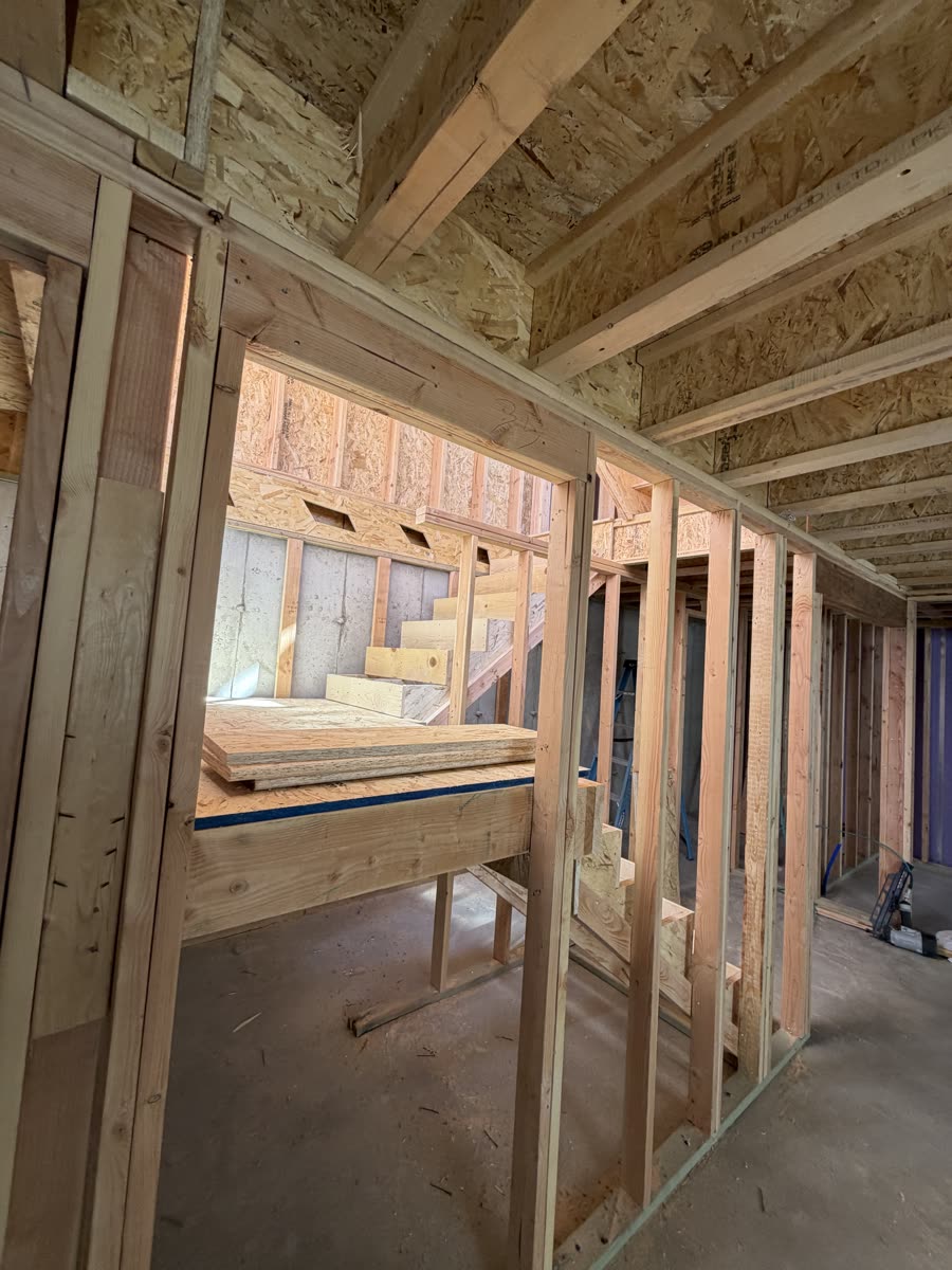 Interior wall framing with natural light in a Utah custom home